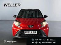 Gebraucht Toyota Aygo 72 PS (52 kW) 2025 Chili red / night sky black (rot) Kleinwagen