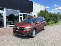 Gebraucht Dacia Jogger Expression 110 PS (80 kW) 2024 Terracottabraun metallic Van / Kleinbus