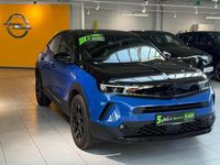 Gebraucht Opel Mokka-e 100 kW (136 PS) 2023 Perl blau/voltaik blau (metallic) SUV
