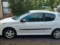 Używany Peugeot 206 60 KM (44 kW) 2011 Biały Hatchback