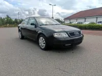 Używany Audi A6 150 KM (110 kW) 1999 Czarny Sedan/Limuzyna
