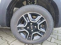 Gebraucht Dacia Spring Extreme 47 kW (65 PS) 2023 Diamantsilbergrau Kleinwagen