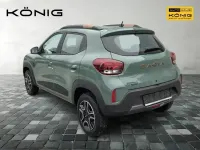 Gebraucht Dacia Spring Extreme 47 kW (65 PS) 2023 Olivgrün Kleinwagen