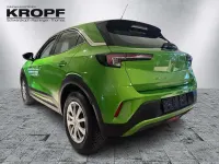 Gebraucht Opel Mokka Enjoy 136 PS (100 kW) 2023 Lackierung matcha green/typ au SUV