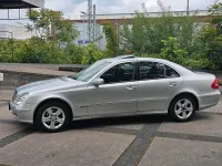 Używany Mercedes E320 204 KM (150 kW) 2004 Srebrny Sedan/Limuzyna