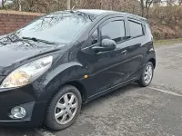 Gebraucht Chevrolet Spark 94 PS (69 kW) 2011 Schwarz Kleinwagen