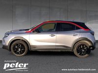 Gebraucht Opel Mokka-e GS Line 100 kW (136 PS) 2023 Kontrast grau/quarz silber (metallic) SUV