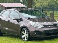 Gebraucht Kia Rio Attract 86 PS (63 kW) 2013 Braun Limousine