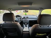 Brugt BMW 116 122 HK (89 kW) 2010 Sort Hatchback