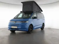Gebraucht VW T7 Beach 245 PS (180 kW) 2026 Medium blue / deep black perleff Van