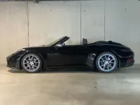 Gebraucht Porsche 992 394 PS (289 kW) 2025 Schwarz (metallic) Cabrio