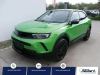 Gebraucht Opel Mokka 131 PS (96 kW) 2022 Matcha grün schwarz dach SUV
