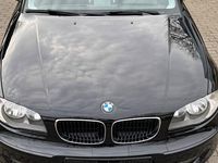 Gebraucht BMW 116 122 PS (89 kW) 2009 Schwarz Kleinwagen