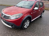 Second-hand Dacia Sandero Stepway 88 CP (64 kW) 2011 Roșu Berlinǎ