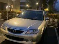 Usata Mazda 323 98 CV (72 kW) 2002 Argento Utilitaria