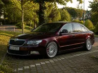 Używany Skoda Superb 160 KM (117 kW) 2009 Czerwony Sedan/Limuzyna