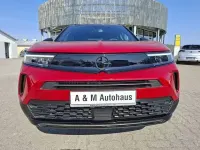 Gebraucht Opel Mokka 136 PS (100 kW) 2024 Lackierung rot rubi/typ aussen SUV