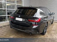 Gebraucht BMW 330e Performance 292 PS (214 kW) 2021 Saphirschwarz metallic Kombi