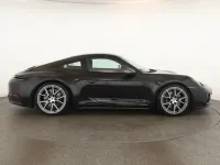 Gebraucht Porsche 911 Carrera T 394 PS (289 kW) 2025 Tiefschwarzmetallic Coupé