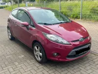 Używany Ford Fiesta 80 KM (58 kW) 2012 Purpurowy Sedan/Limuzyna