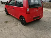 Gebraucht Daihatsu Cuore 58 PS (42 kW) 2004 Rot Kleinwagen