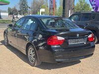 Second-hand BMW 318 129 CP (94 kW) 2007 Negru Berlinǎ