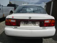 Używany Mazda 323 88 KM (64 kW) 1996 Biały Sedan/Limuzyna