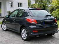Gebraucht Peugeot 206 60 PS (44 kW) 2011 Schwarz Kleinwagen