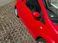 Gebraucht Toyota Aygo 68 PS (50 kW) 2013 Rot Kleinwagen