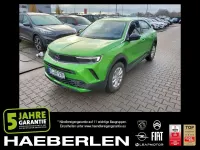 Gebraucht Opel Mokka-e Edition 100 kW (136 PS) 2022 Matcha green/ikone gruen (metallic) SUV