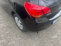 Używany Opel Astra Design Edition 101 KM (74 kW) 2011 Czarny Sedan/Limuzyna