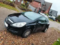 Używany Opel Corsa Edition 60 KM (44 kW) 2009 Czarny Sedan/Limuzyna
