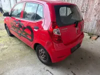 Gebraucht Hyundai i10 Edition 69 PS (50 kW) 2013 Electric red / sol Kleinwagen