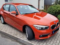 gebraucht BMW 118 i in Valencia Orange mit HU bis 2026