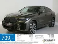 Gebraucht BMW X6 M50 Shadowline 530 PS (389 kW) 2023 Manhatten met. (braun) SUV