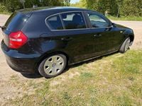 Second-hand BMW 116 122 CP (89 kW) 2011 Negru Hatchback
