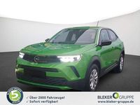 Gebraucht Opel Mokka Enjoy 101 PS (74 kW) 2023 Lackierung matcha green/typ aussenverkleidung metalliclackierung SUV