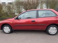 Gebraucht Mazda 323 88 PS (64 kW) 1997 Rot Kleinwagen