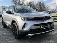 Gebraucht Opel Mokka Elegance 131 PS (96 kW) 2022 Kontrast grau/quarz silber SUV