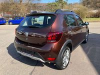 Gebraucht Dacia Sandero Prestige 90 PS (66 kW) 2017 Turmalinbraun Kleinwagen