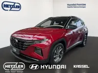 Gebraucht Hyundai Tucson Trend 150 PS (110 kW) 2021 Sunset red / phantom black / m SUV