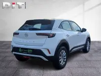 Gebraucht Opel Mokka Enjoy 131 PS (96 kW) 2023 Lack weiss banquise/typ aussenverkleidun (metallic) SUV