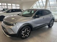 Gebraucht Opel Mokka Elegance 101 PS (74 kW) 2022 Kontrast grau/quarz silber (metallic) SUV