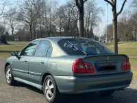 Gebraucht Mitsubishi Carisma 103 PS (75 kW) 2003 Grün Limousine
