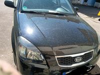 Second-hand Kia Rio 75 CP (55 kW) 2010 Negru Hatchback