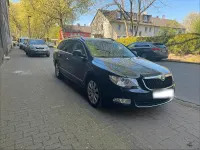 Używany Skoda Superb 140 KM (102 kW) 2012 Czarny Kombi