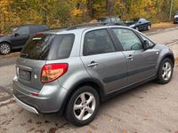 Usado Suzuki SX4 107 HP (78 kW) 2006 Cinzento Sedan