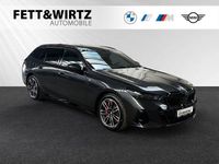 Gebraucht BMW 550e M Sport 489 PS (359 kW) 2025 Sophistograu brillanteffekt metallic Kombi
