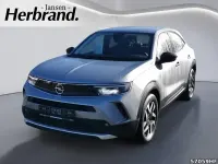 Gebraucht Opel Mokka-e Elegance 100 kW (136 PS) 2022 Kontrast grau/quarz silber SUV