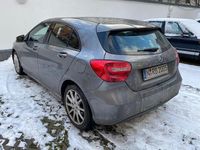 Używany Mercedes A180 122 KM (89 kW) 2012 Szary Sedan/Limuzyna